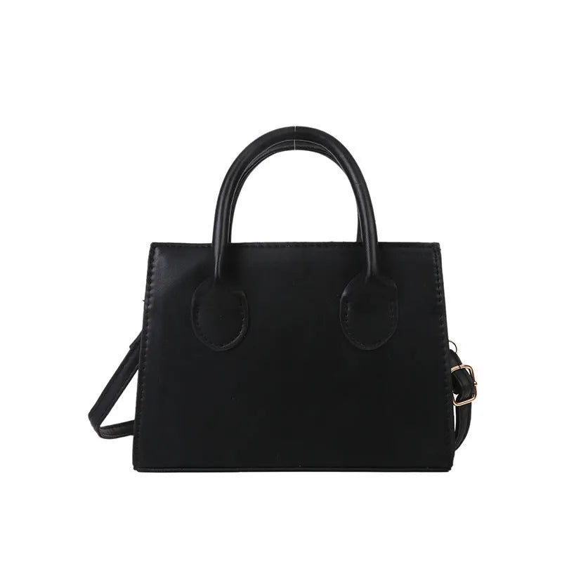 Women's black PU leather horizontal square shoulder bag with single strap and sewing line detailing