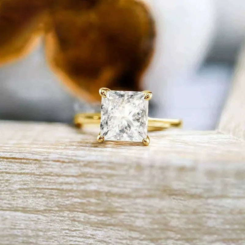 Sterling silver geometric women's ring with a round zirconia stone in silver, gold, or rose gold finish.