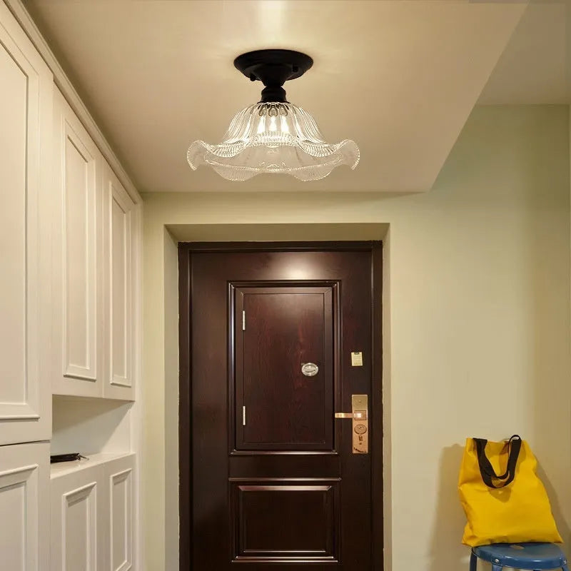 American retro style single-head ceiling or wall lamp with a glass cover.