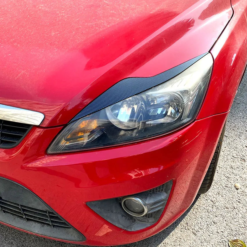 Ford Focus headlight sticker set in carbon fibre pattern or piano black finish