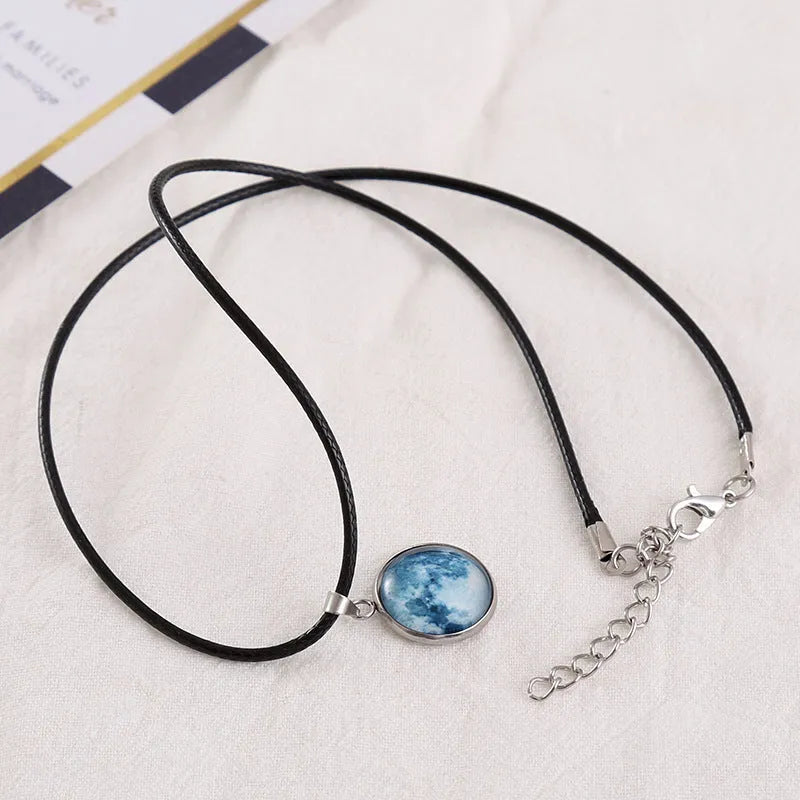 Luminous alloy necklace with a constellation-modelled glass pendant on an adjustable chain.