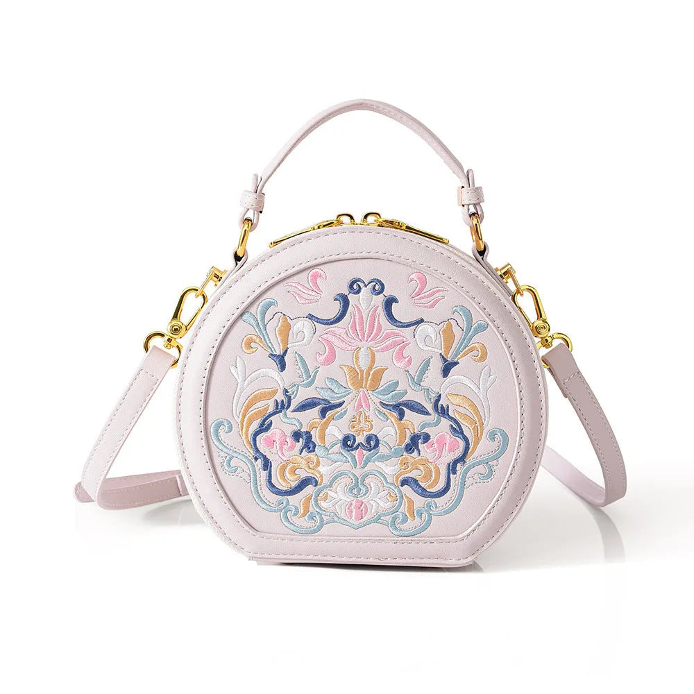 Round PU leather crossbody bag with embroidery and sewing line, available in five colours