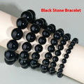 Hand-woven obsidian bracelet with round crystal beads in black stone variations including rainbow eye obsidian