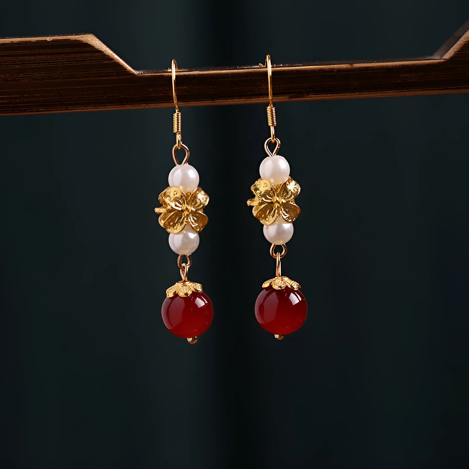 National Han Cheongsam antique earrings in geometric drop design with gold tone electroplated finish.