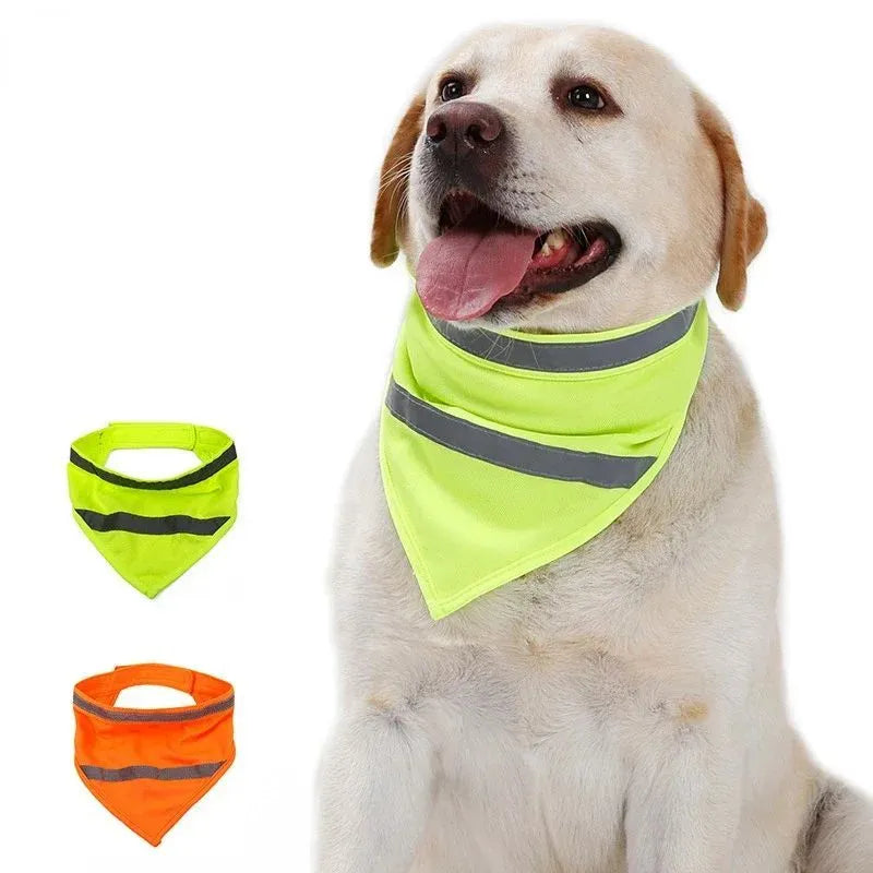 Yellow and orange reflective triangular dog bandana with adhesive strap on a dog's neck.