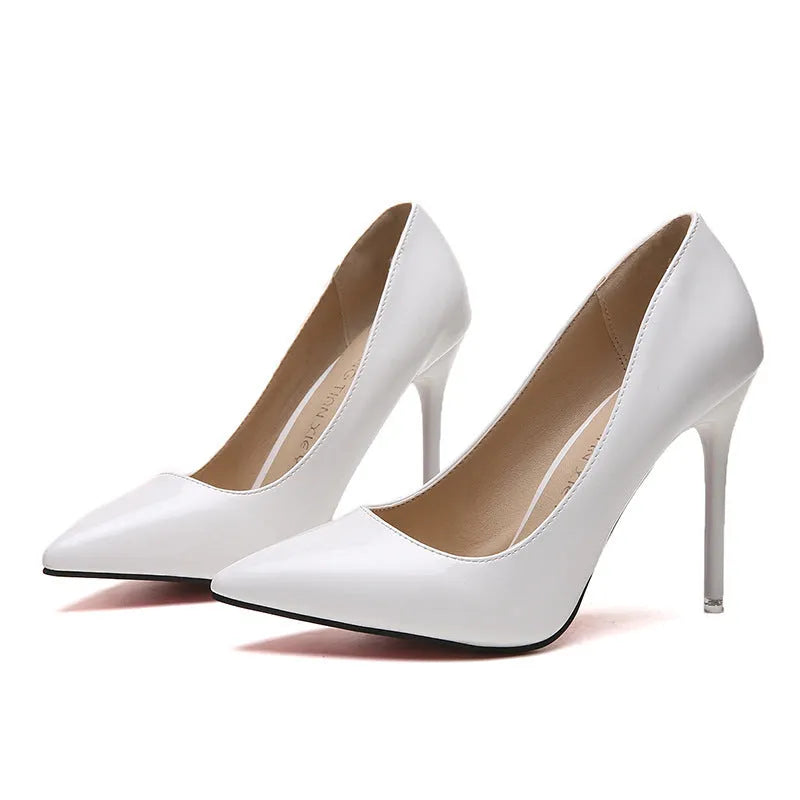Women's pointed toe stiletto high heel pumps in apricot colour with a chunky heel and buckle detail.