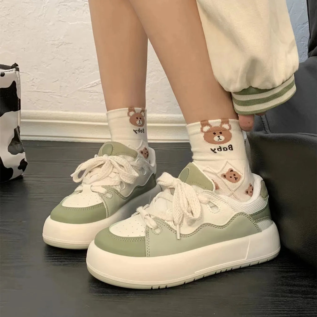 Green women's casual shoes with flat heel and round toe design showing pu mesh upper material