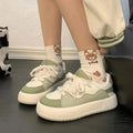 Green women's casual shoes with flat heel and round toe design showing pu mesh upper material