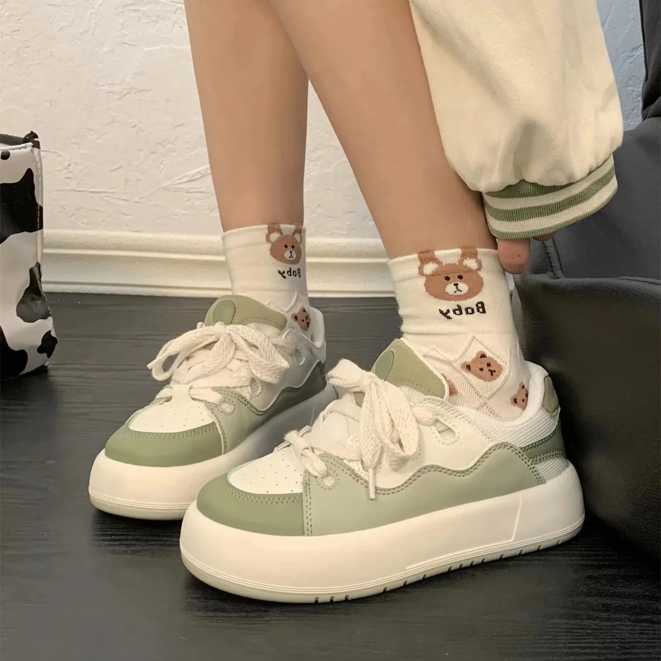 Green women's casual shoes with flat heel and round toe design showing pu mesh upper material