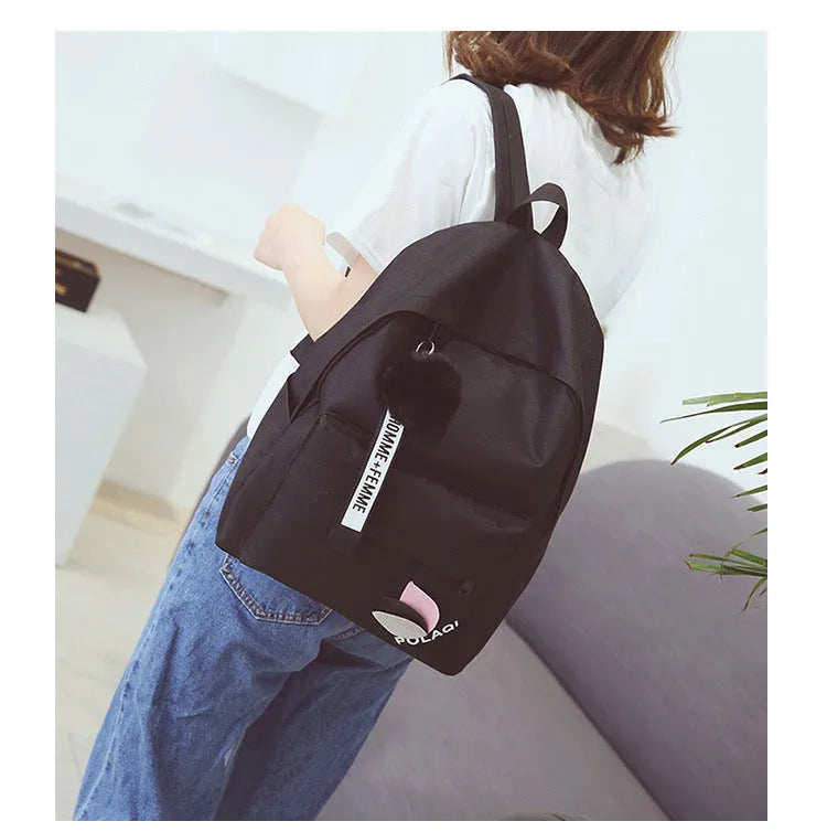 Canvas college style schoolbag backpack in green with leaf pattern, showing 40x28x13cm dimensions