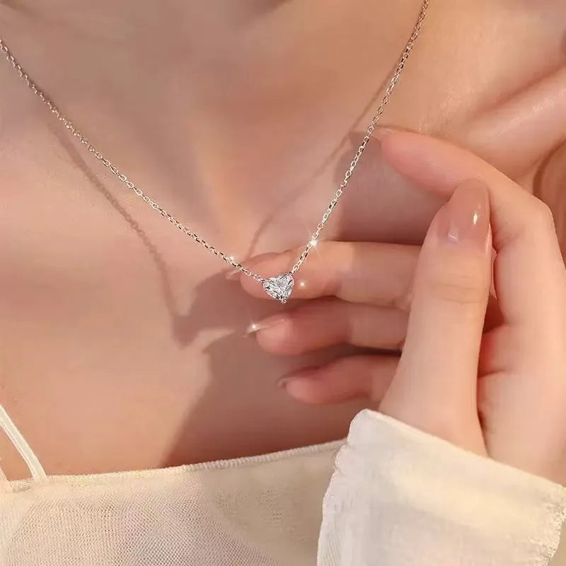 Women's silver-toned copper necklace with simple heart pendant on fine chain