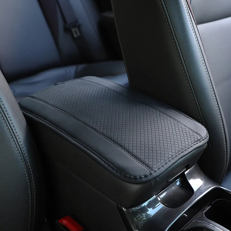 PU leather automotive armrest box cushion measuring 32x19cm in black with red cord detailing