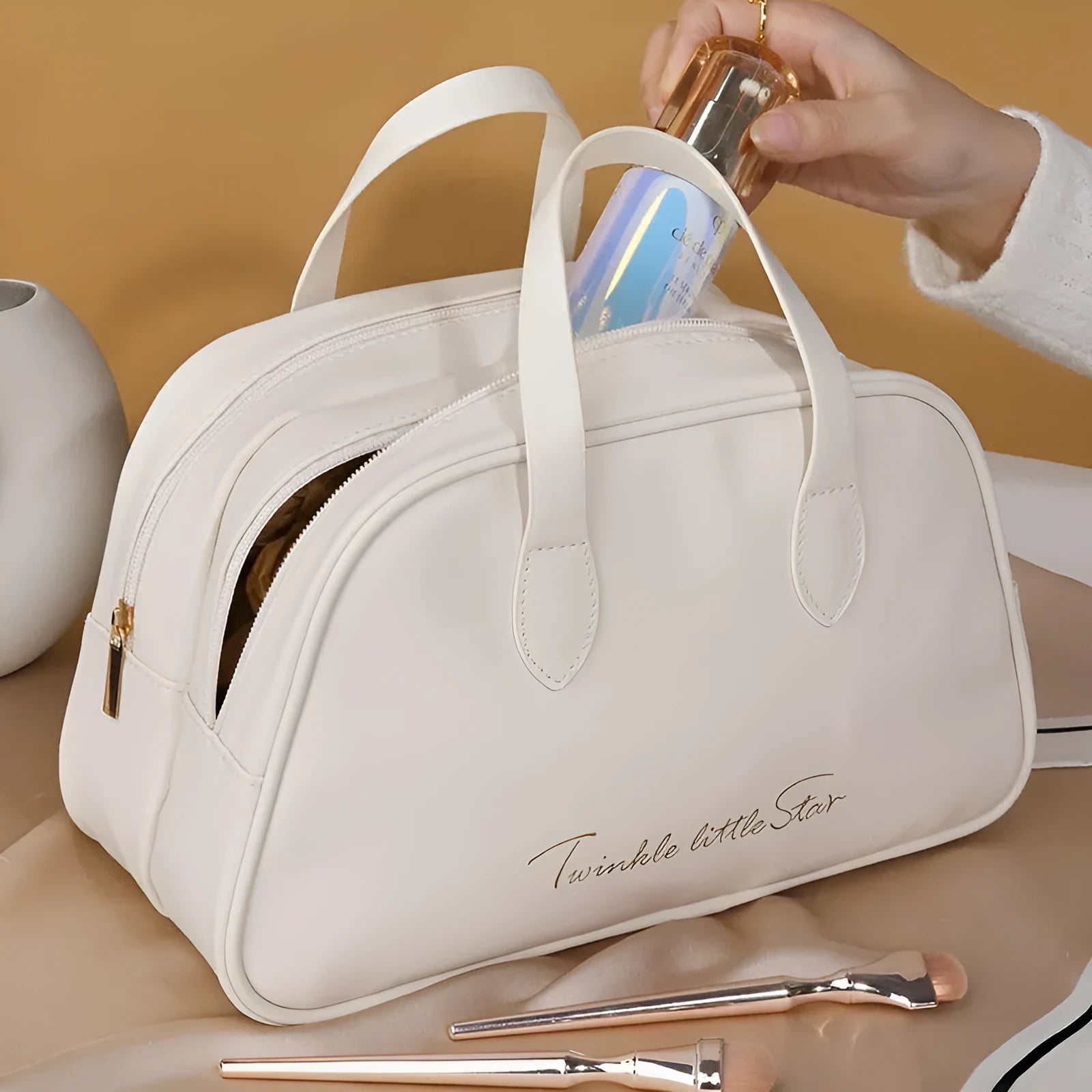 Large capacity PU leather travel toiletry bag in caramel mocha colour showing dry wet separation compartments.