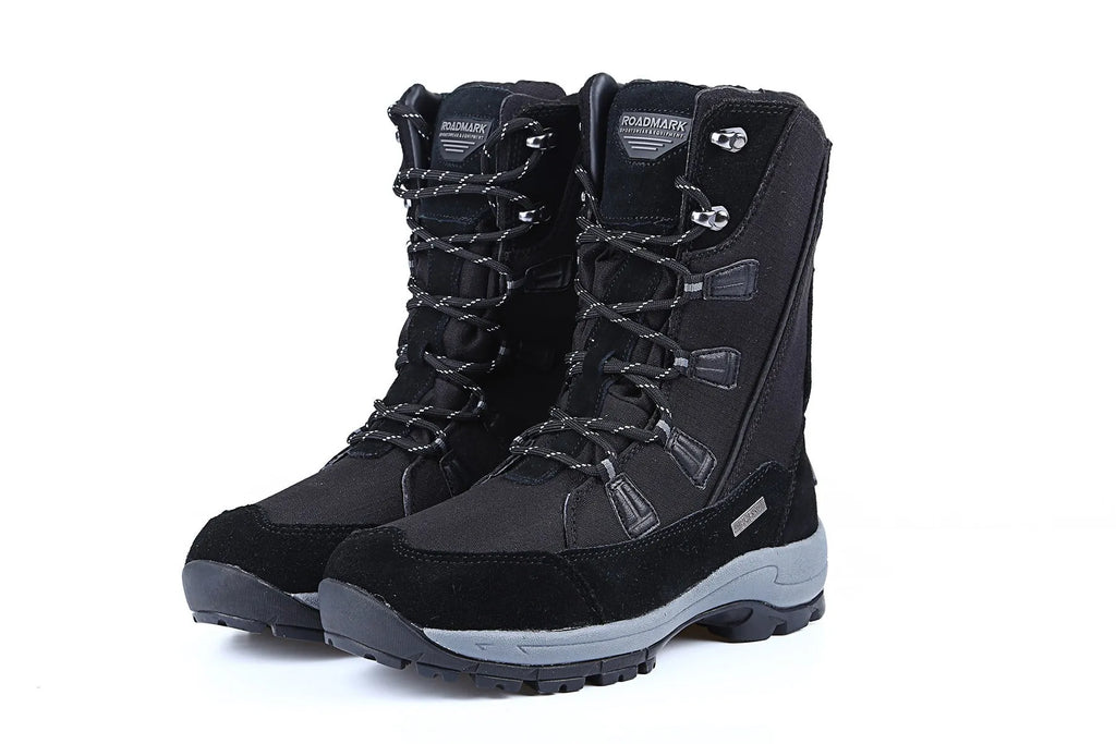 Women's black mid-calf snow boots with a round toe and genuine leather upper on a rubber sole.