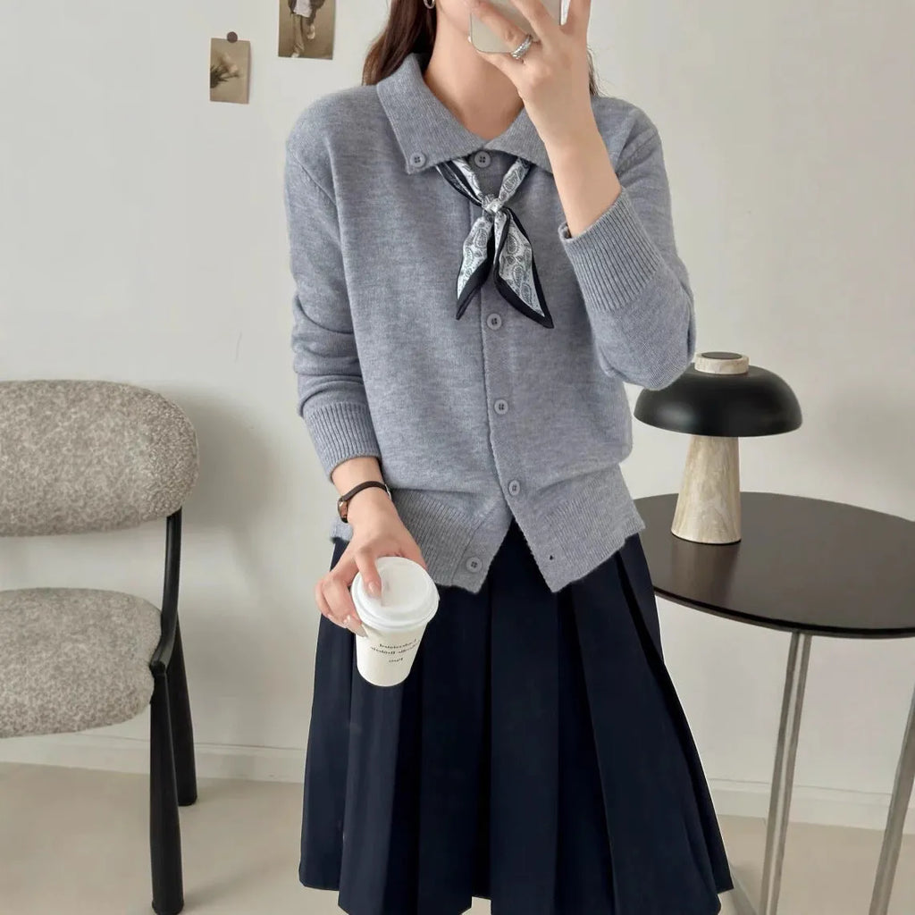 Beige lapel scarf style acrylic cardigan sweater with long sleeves and splicing detail.