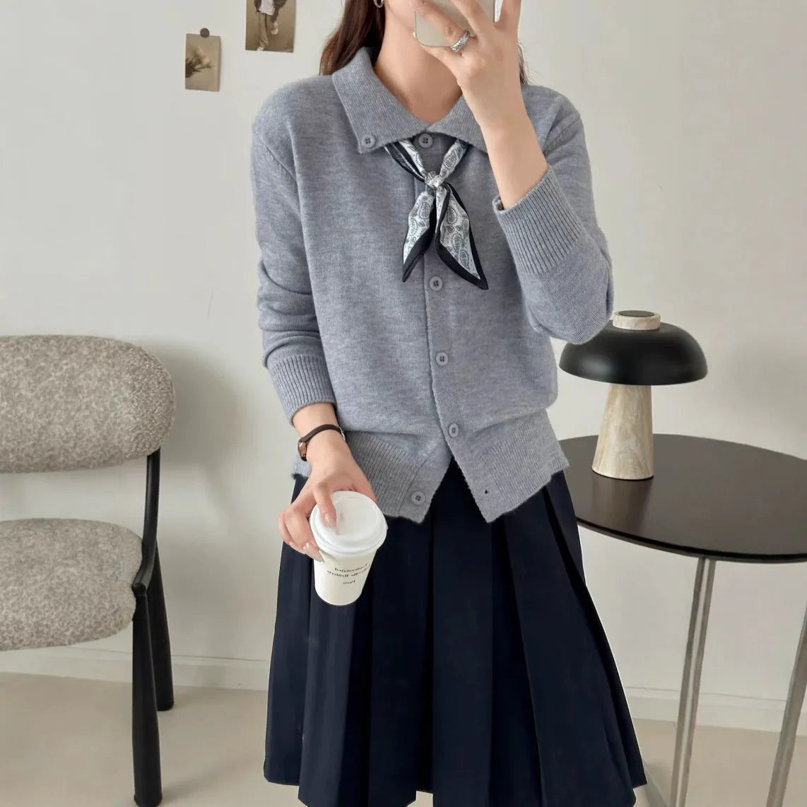 Beige lapel scarf style acrylic cardigan sweater with long sleeves and splicing detail.