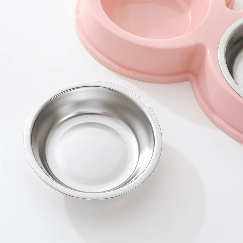 Stainless steel pet double bowl for food and water in blue, green, or pink.