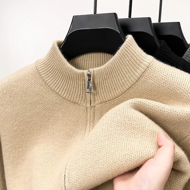 Man wearing a grey stand collar knitted cardigan with a front zipper.