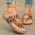 Leopard print Roman style slippers with toe covering and wooden sole.