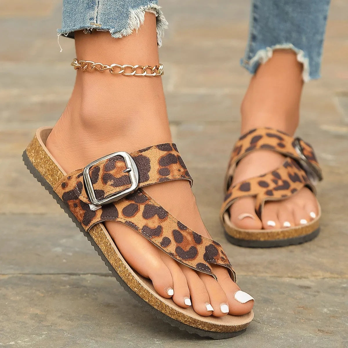 Leopard print Roman style slippers with toe covering and wooden sole.