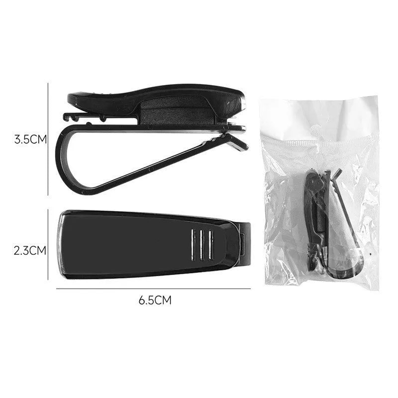 Black plastic car sunshade clip for holding glasses and ID cards, shown next to a ruler showing 6.5cm length.