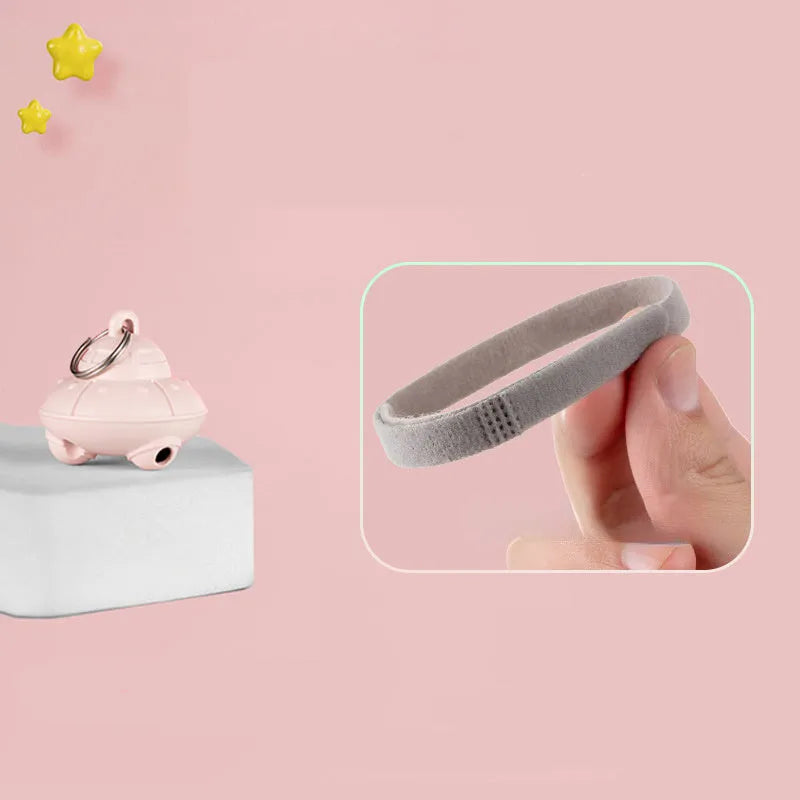 Automatic cat laser toy attached to green collar with USB charging port visible