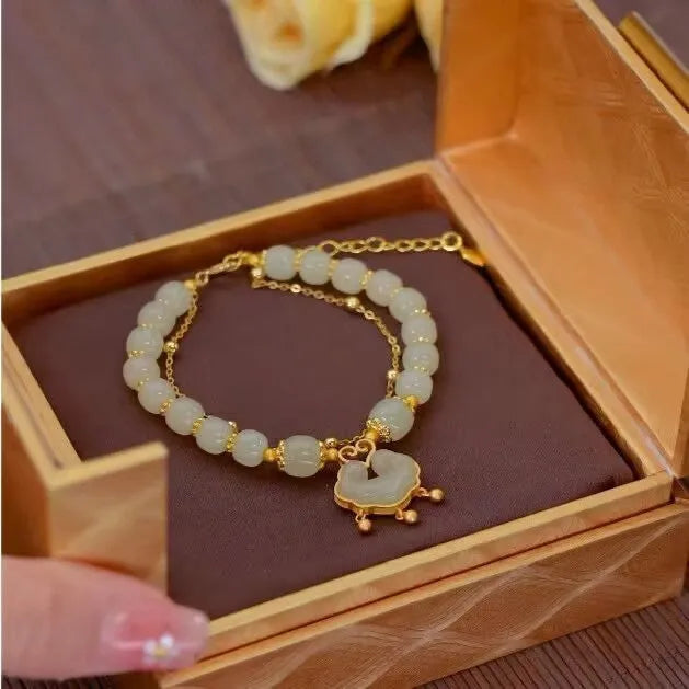 Women's green double-layer bracelet with safety lock pendant in drop shape design