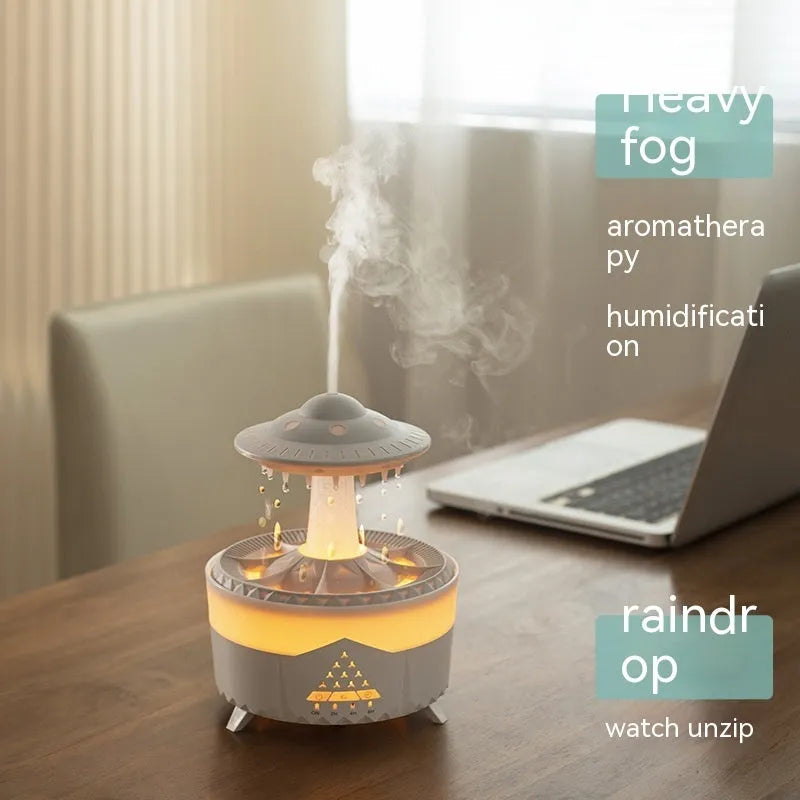 White UFO-shaped humidifier with water droplets creating mist and rain sounds