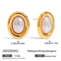 Close-up of a pair of women's stainless steel vintage pearl ear studs with a silver-toned post on a white background.