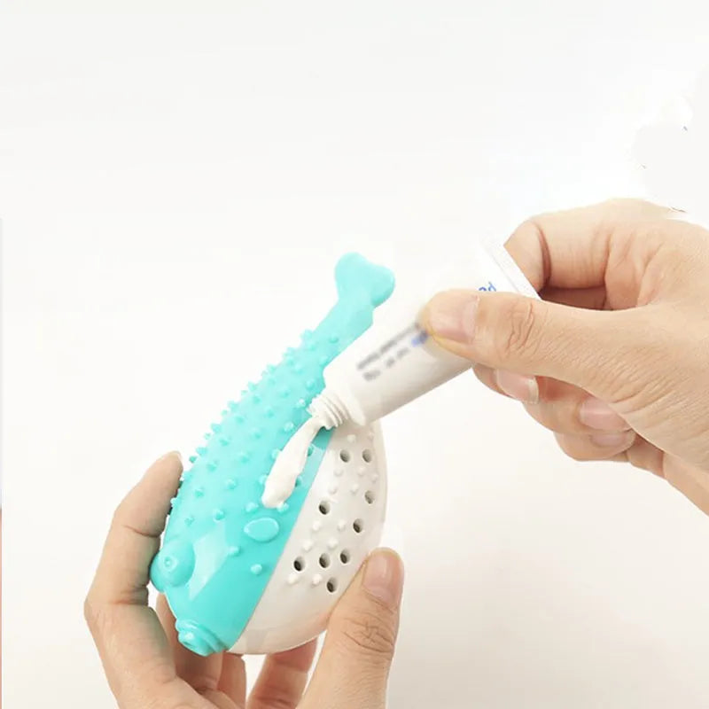 Mint Toys blue silicone cat fish chew toy and teaser on a plain surface showing fish shape and size.