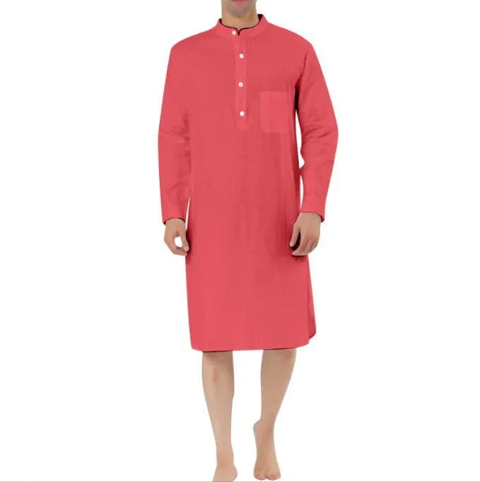 A man wearing a dark blue cotton shirt-style full-length robe for loungewear.