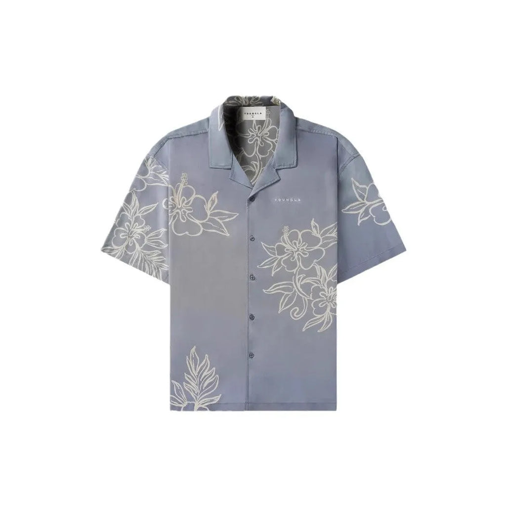 Man's loose-fitting short sleeve cardigan top with a floral print in light colours.