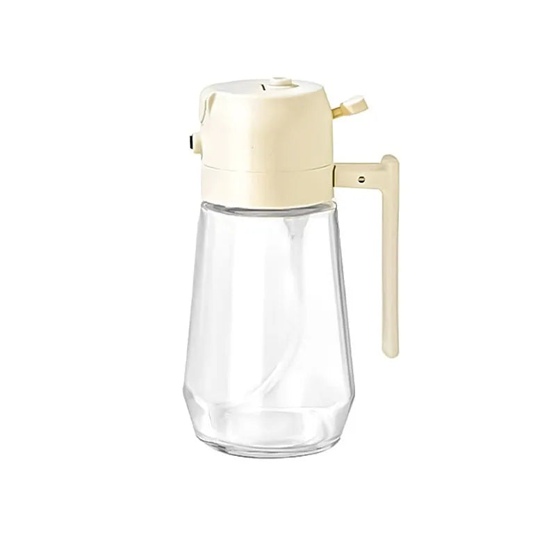 Glass olive oil sprayer bottle with ergonomic handle in beige, showing spray and pour functions.