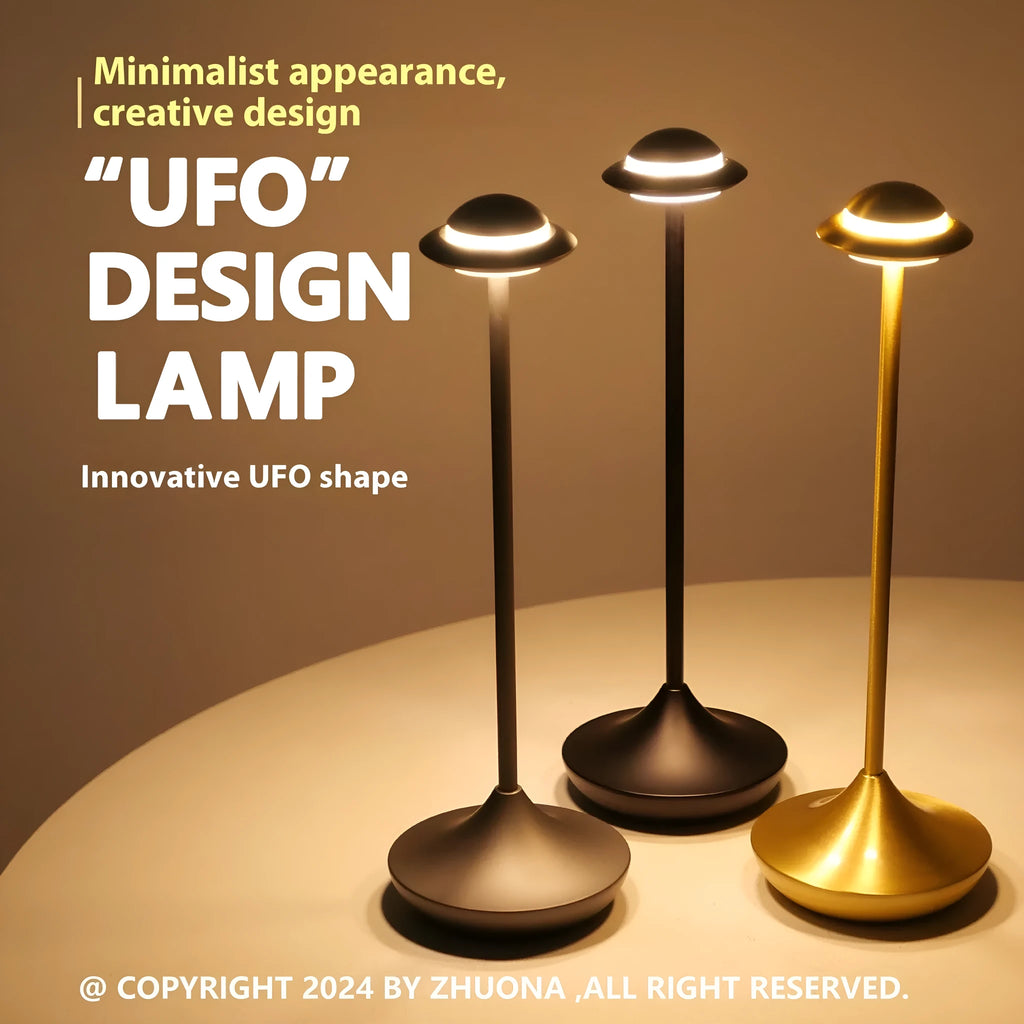 Creative metal UFO-shaped rechargeable desk lamp with touch dimming in gold, grey, and black colours.