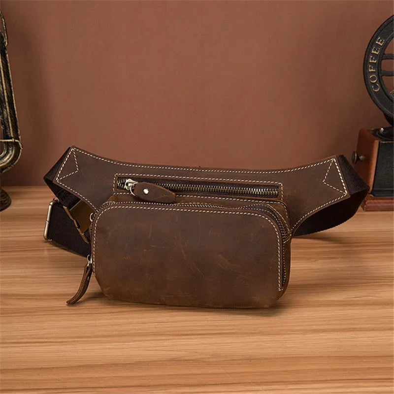Brown top layer cowhide leather men's sports waist bag with pull-tab closure.