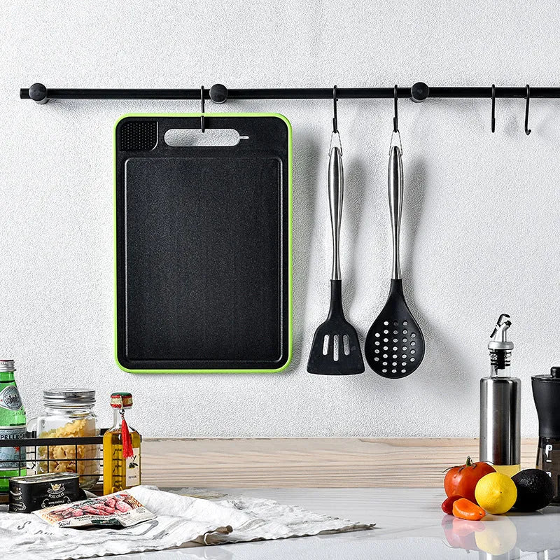 Grey square aluminium cutting board with double-sided design showing cutting surface and grinding teeth