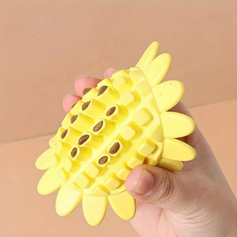Yellow sunflower-shaped rubber dog chew toy with squeaker