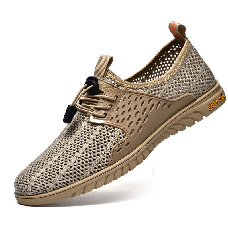 Men's black mesh casual sneaker with elastic band and rubber sole on a light background.