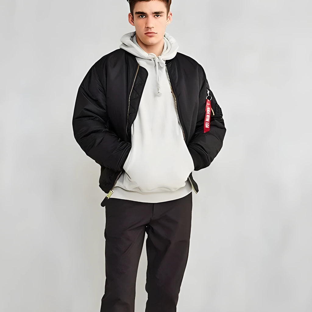 Men's army green loose fit cotton-padded pilot jacket with a double-sided construction on a hanger.