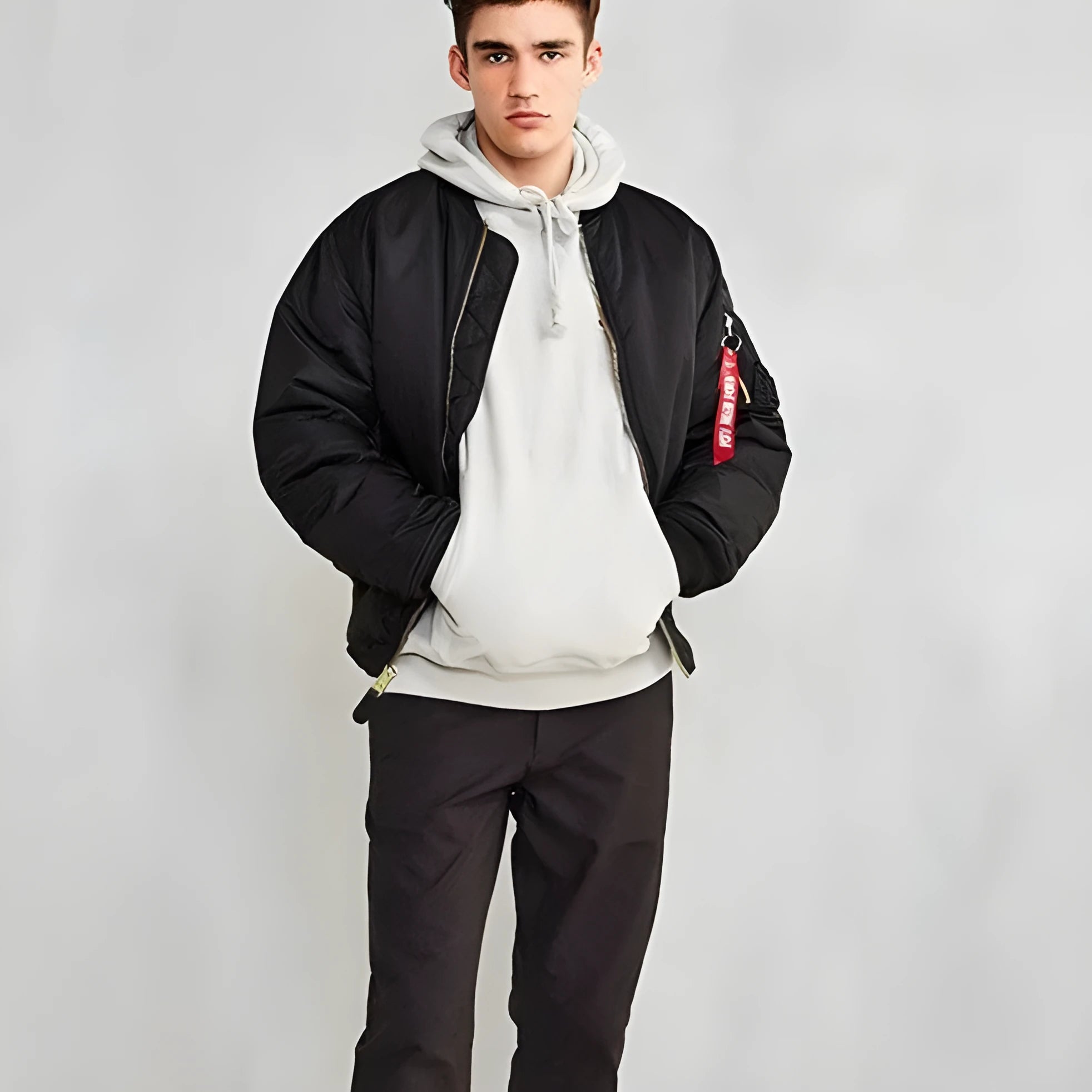 Men's army green loose fit cotton-padded pilot jacket with a double-sided construction on a hanger.