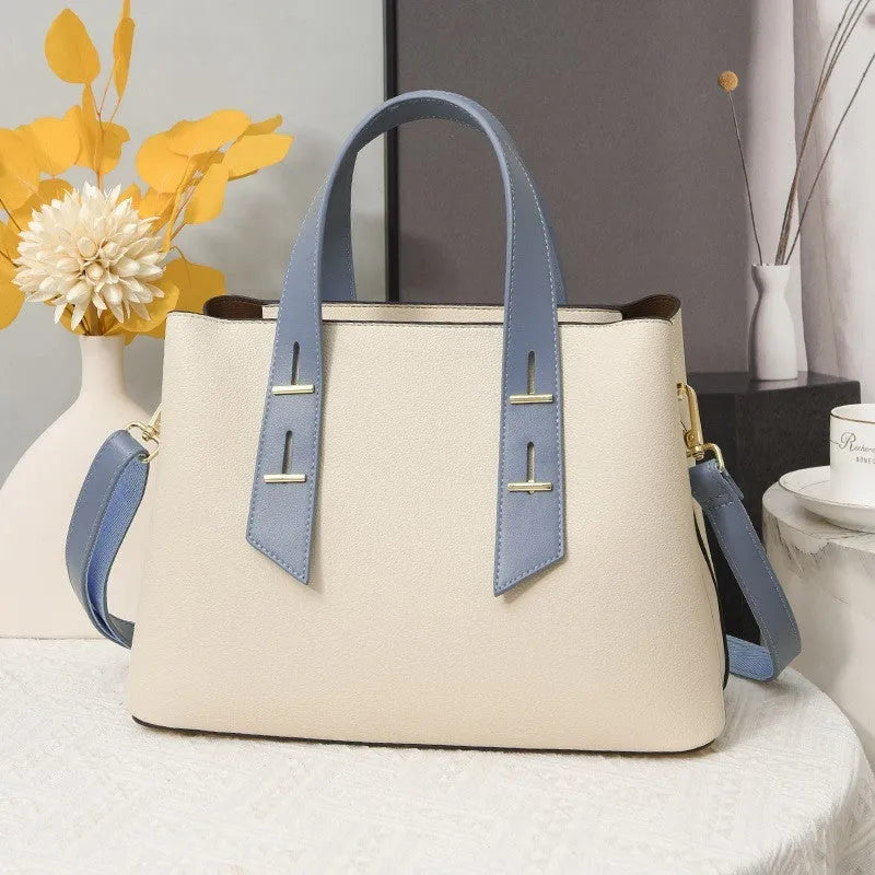 Simple shoulder messenger handbag for women in PU, medium-soft, retro style, available in eight colours including black and beige with blue.
