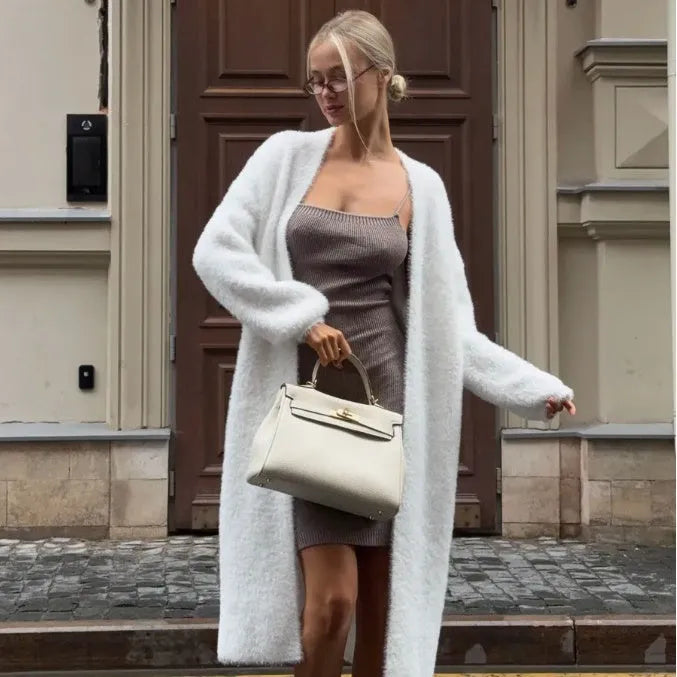 Long white women's cardigan jacket with thick knit and open front.