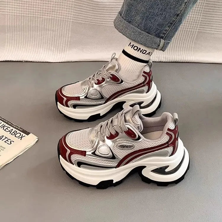 Women's red and silver clunky platform sneakers with mesh lining and rubber sole.