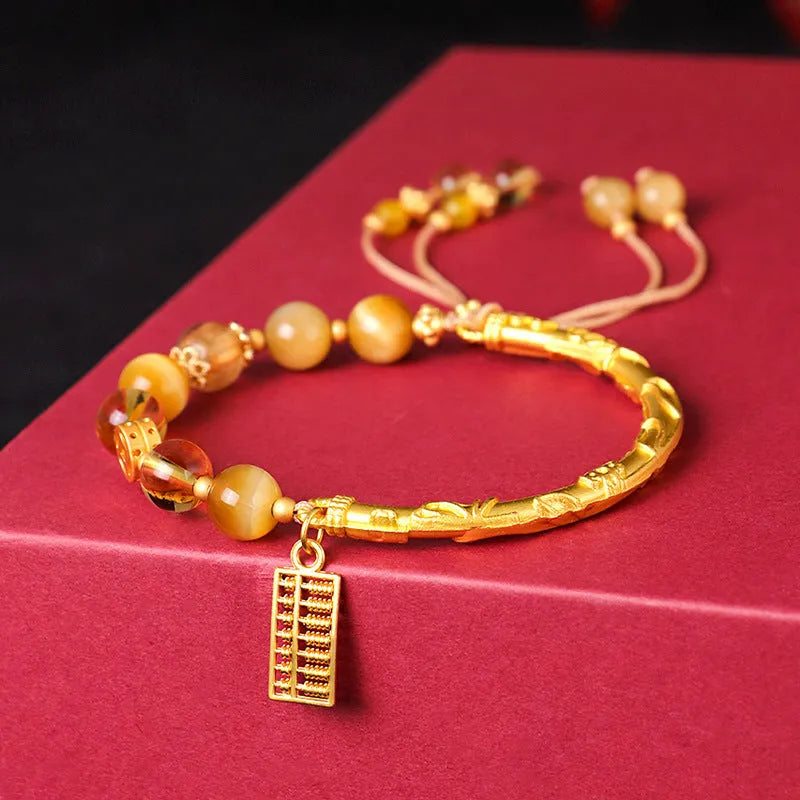 Women's abacus tag bracelet with tigereye and citrine beads and copper diamond-shaped tag