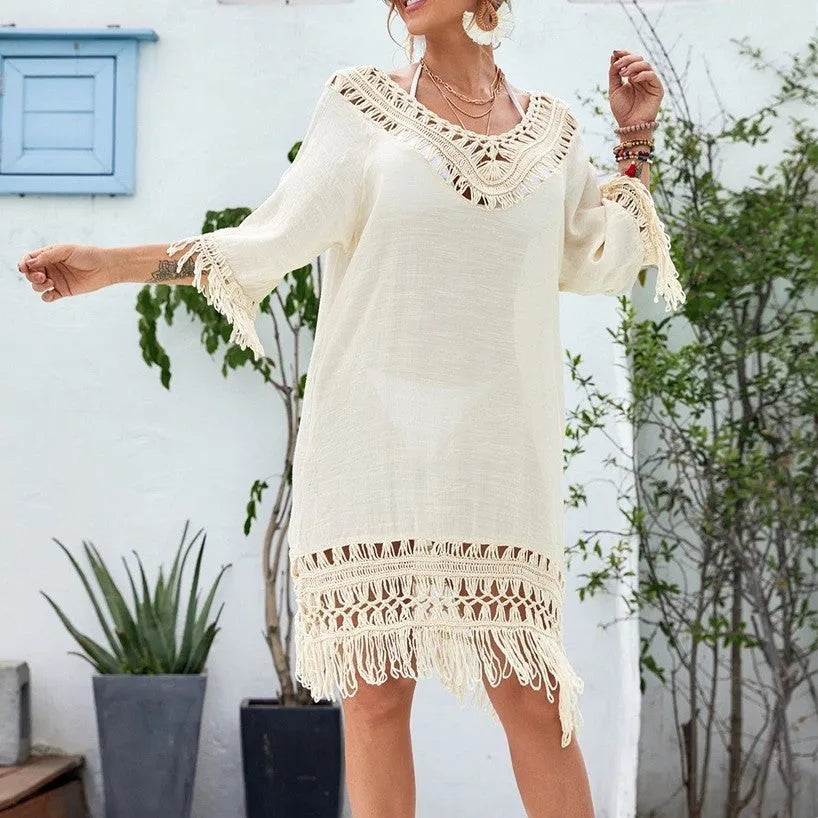 Apricot-coloured crochet patchwork beach dress with half sleeves on a model