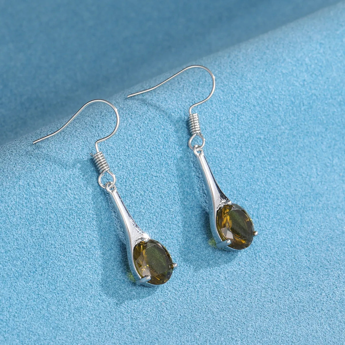 Women's olive green topaz earrings with water drop shape and retro minimalist design