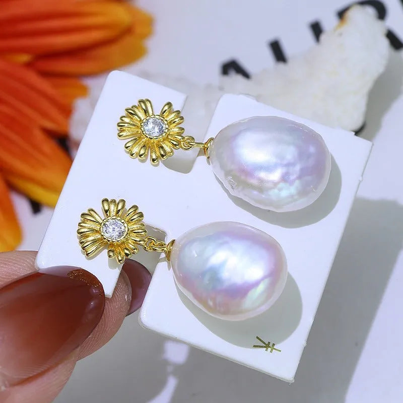 S925 sterling silver baroque flower earrings on a silver ring holder, showing gold and silver colour frame options.