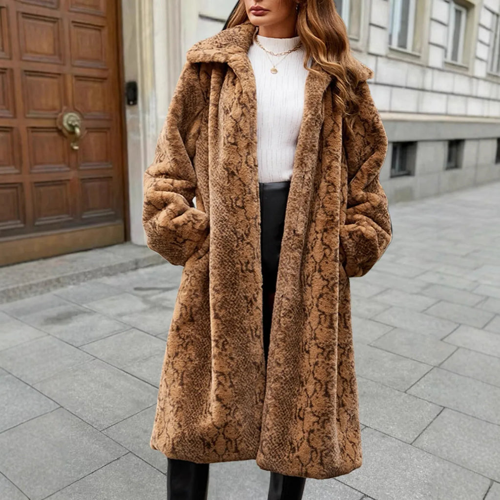 A woman wearing a brown leopard print over-the-knee faux fur coat with regular sleeves.