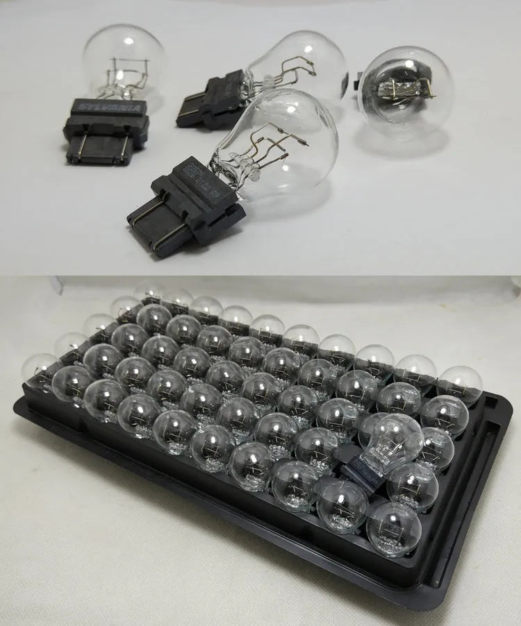 Wagner brake light bulb with dual wires, plastic alignment dots, and 16mm socket