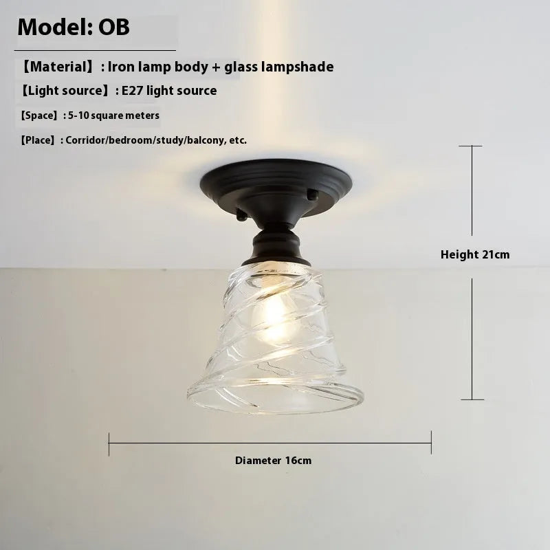 American retro style single-head ceiling or wall lamp with a glass cover.